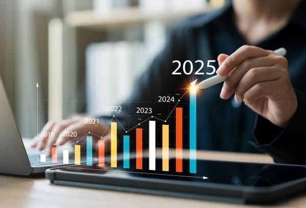 A businesswoman studies digital data to analyze positive business trends in 2025. This analysis reveals insights into business, marketing, and economic concepts.